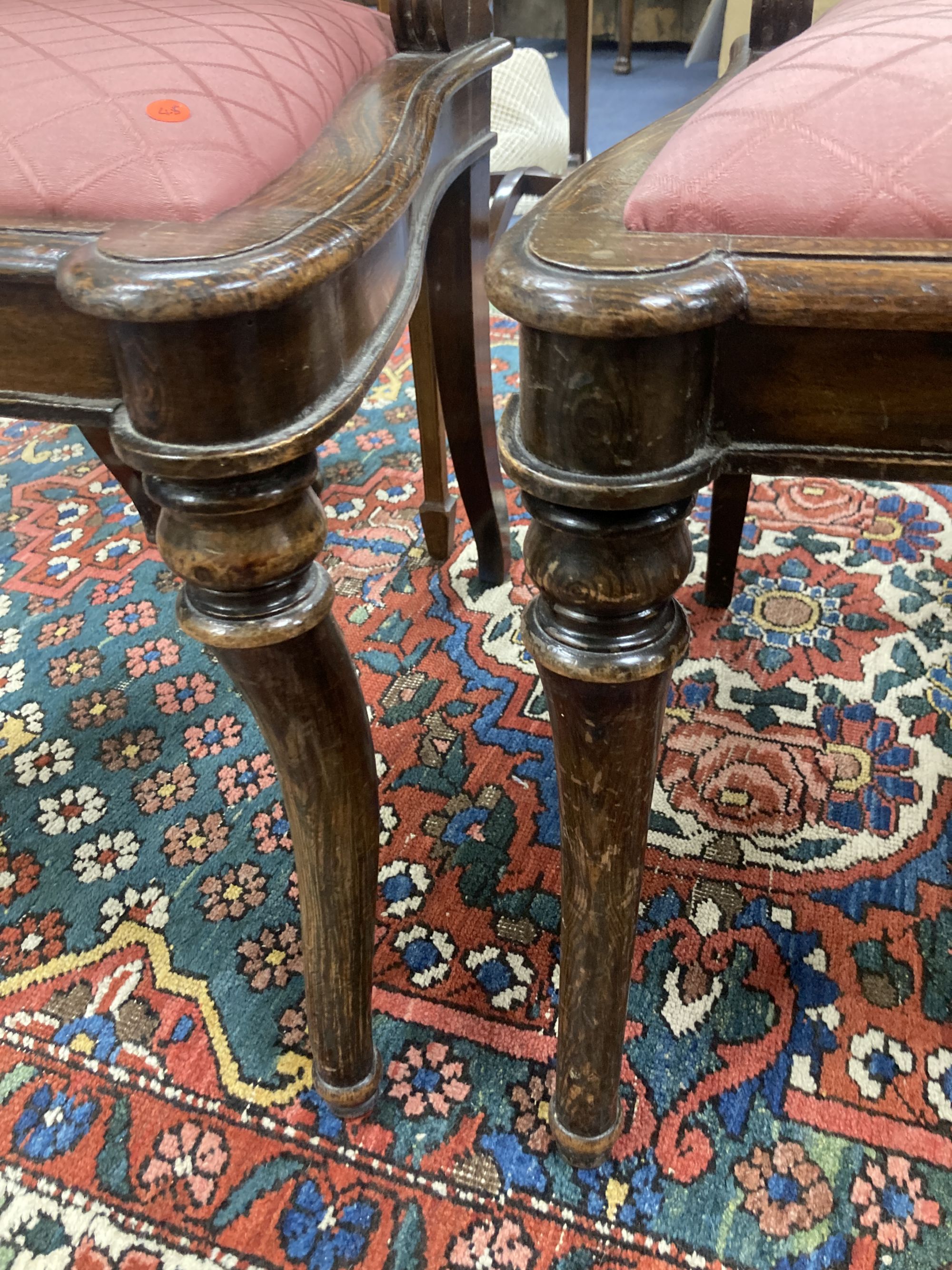 A pair of Regency beech simulated rosewood brass inlaid dining chairs, with pink upholstered seats